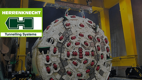 Herrenknecht Logo and Brenner Basic tunnel in the background